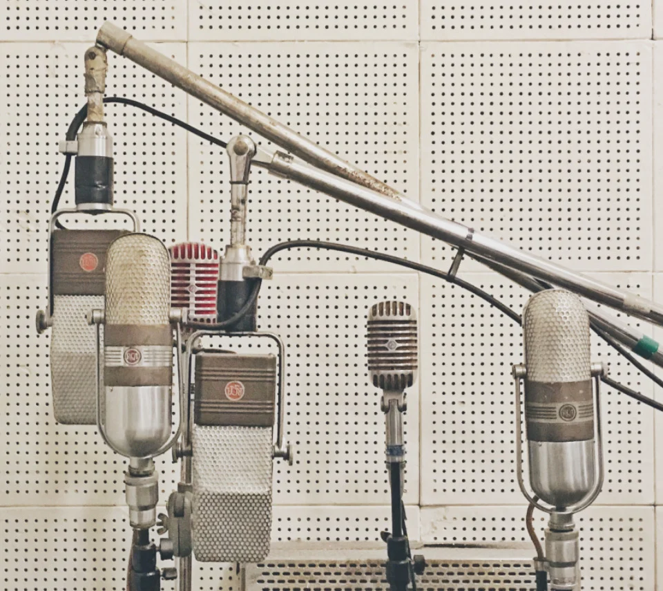 A row of vintage studio microphones