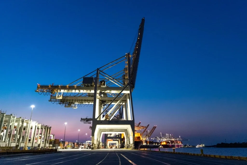 Container cranes on a quay at dusk
